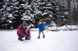 © Westend61 - Father and little son having a snowball fight in winter forest