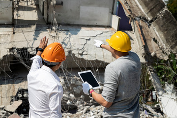 Wall Mural - Demolition control supervisor and foreman discussing on demolish building.