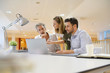 © goodluz - Startup team going through business ideas in office
