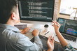 © Ngampol - Team of Professional Developer programmer cooperation meeting and brainstorming and programming in website working a software and coding technology, writing codes and database