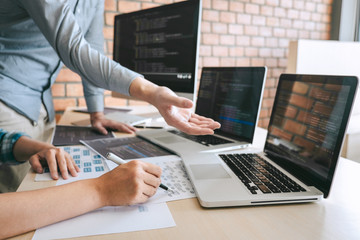 Wall Mural - professional developer programmer cooperation meeting and brainstorming and programming in website w