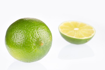 Sticker - Tahiti lemon isolated on white background - Citrus × latifolia. Text space