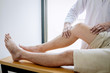 © Ngampol - Doctor physiotherapist assisting a male patient while giving exercising treatment massaging the leg of patient in a physio room, rehabilitation physiotherapy concept