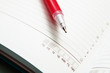 © Наталья Маяк - Dates shown in the calendar in the diary and a red penfor writing, selective focus