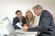 © goodluz - Couple signing contract with real estate agent