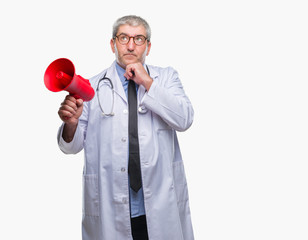 Sticker - Handsome senior doctor man yelling through megaphone over isolated background serious face thinking about question, very confused idea