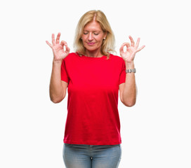 Sticker - Middle age blonde woman over isolated background relax and smiling with eyes closed doing meditation gesture with fingers. Yoga concept.