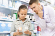 © Nestor - Pharmacist helping little girl at the drugstore