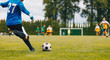 © matimix - Soccer Football Goalkeeper Goal Kick. Goalie Kick on the Pitch During Match. Goalkeeper Restarting Play in a Game