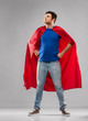 © Syda Productions - super power and people concept - happy young man in red superhero cape over grey background