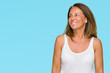 © Krakenimages.com - Beautiful middle age casual adult woman over isolated background looking away to side with smile on face, natural expression. Laughing confident.