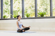 © kite_rin - Woman meditating. Girl practicing yoga in class. Meditation, balance, relaxation, harmony, exercising concept