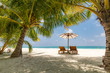© icemanphotos - Beautiful beach. Chairs on the sandy beach near the sea. Summer holiday and vacation concept. Tropical beach landscape. Exotic vacation and summer holiday concept design