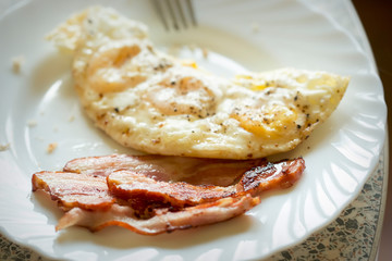 Wall Mural - Fried egg with bacon 