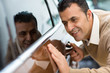 © Nestor - Happy mature man at the car dealership