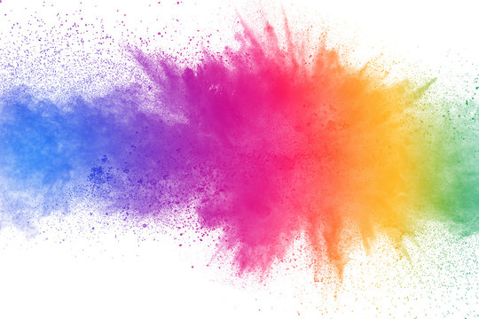 colorful powder explosion on white background. abstract pastel color dust particles splash.