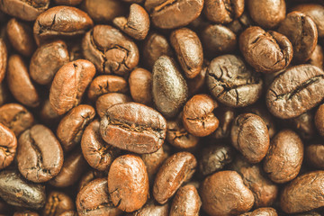 Roasted coffee beans closeup texture background