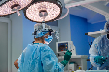 Wall Mural - surgery, medicine and people concept - group of surgeons at operation in operating room at hospital