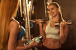 © Nestor - Young beautiful female friends working out at the gym