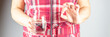 © Angela Rohde - Woman holding a glass of water in one hand and one pill in the other, banner