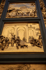 Wall Mural - Florence, Italy - February 27, 2019 : Details of the Florence Baptistery, Gates of Paradise  - Isaac with Esau and Jacob panel by Lorenzo Ghiberti