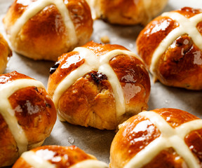 Poster - Hot cross buns, freshly baked hot cross buns on white parchment paper. Traditional easter food