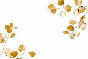 Borders of the frame of gold branches, eucalyptus leaves on a white background. flat layout, top view