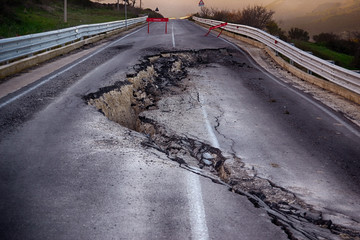 Asphalt road destroyed by the landslide 