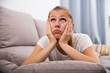 © JackF - Sad woman is propped her cheeks with hands because she bored
