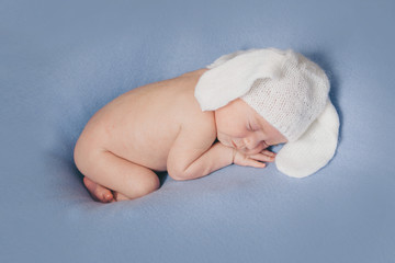 Wall Mural - newborn baby in a hat with ears