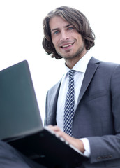 Wall Mural - portrait of successful businessman working on laptop