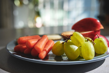 a plate of fruit and vegetables