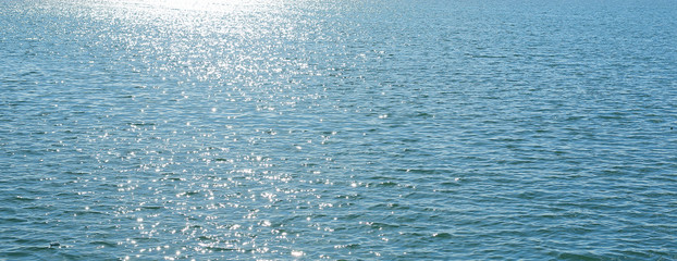 Landscape view of Sparkle sunshine reflection on the blue sea.