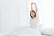 © saksit - Young Asian woman in the morning she stretching in her bed in the bedroom