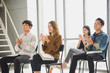 © linghaa - Young Asian people audiences seminar group smile and applaud to the speaker in meeting room.