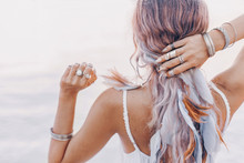 Beautiful Young Boho Woman Close Up With Pink Feathers And Accessories At Sunset