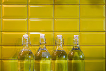 Classic Vintage Water Bottles On Yellow Tiles Background