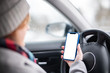 © mahod84 - Woman uses a smartphone while driving at the wheel. Template, mockup.