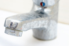 Dirty Faucet With Limescale, Calcified Water Tap With Lime Scale On Washbowl In Bathroom