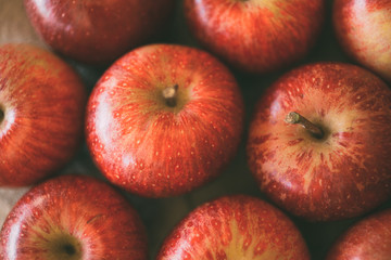 Wall Mural - Red fresh apples as background. Close up view of heap of delicious apples as texture and background. 