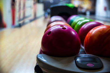  Bowling balls and wooden lane in bowling hall