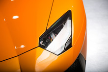 Close Up Shot Of Orange Sports Car Headlight