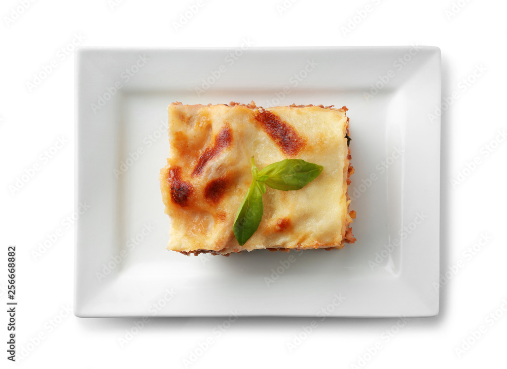 Plate with tasty baked lasagna on white background