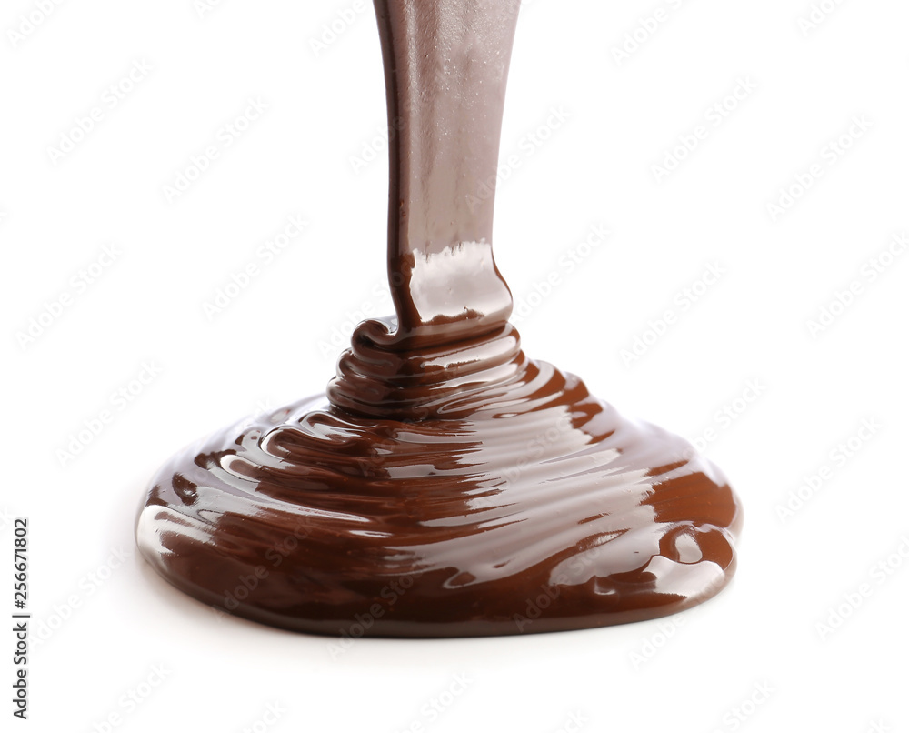 Pouring of melted chocolate on white background