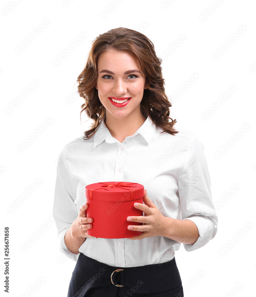 Beautiful young woman with gift on white background