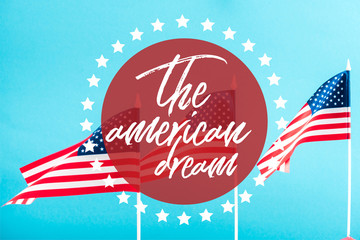 Wall Mural - american flags with the american dream lettering in circle with stars around on blue