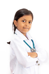 Wall Mural - Cute little girl, playing doctor, posing with white coat