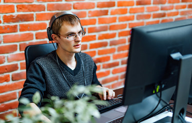program development concept. young man working with computer
