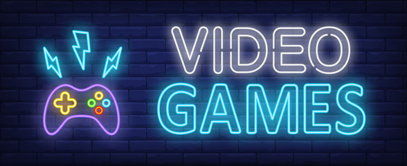 Wall Mural - Video games neon text and gamepad with lightnings