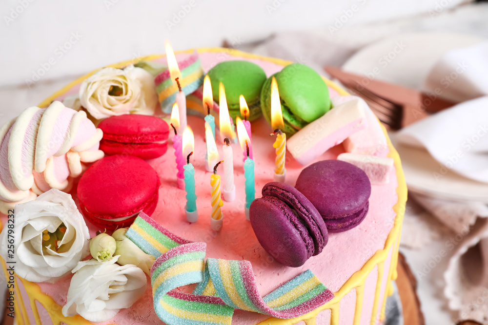 Tasty cake with burning candles, closeup